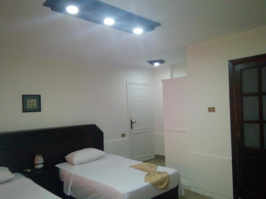Postel nebo postele na pokoji v ubytování Arabesque Hotel