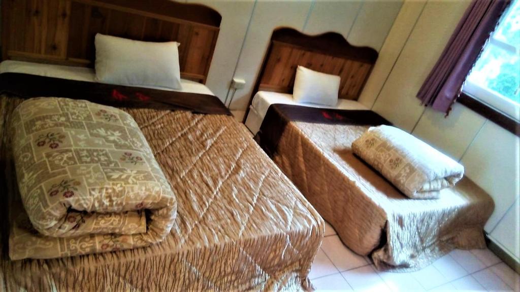 Postel nebo postele na pokoji v ubytování Chun Gu Farm