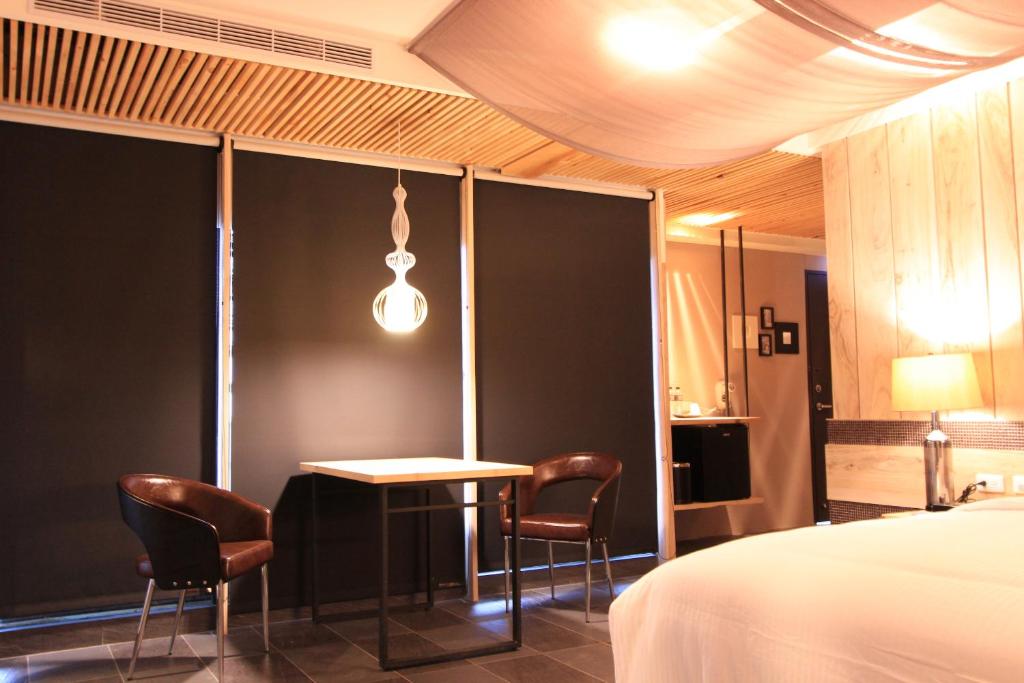 Postel nebo postele na pokoji v ubytování Roppongi Motel - Dalian