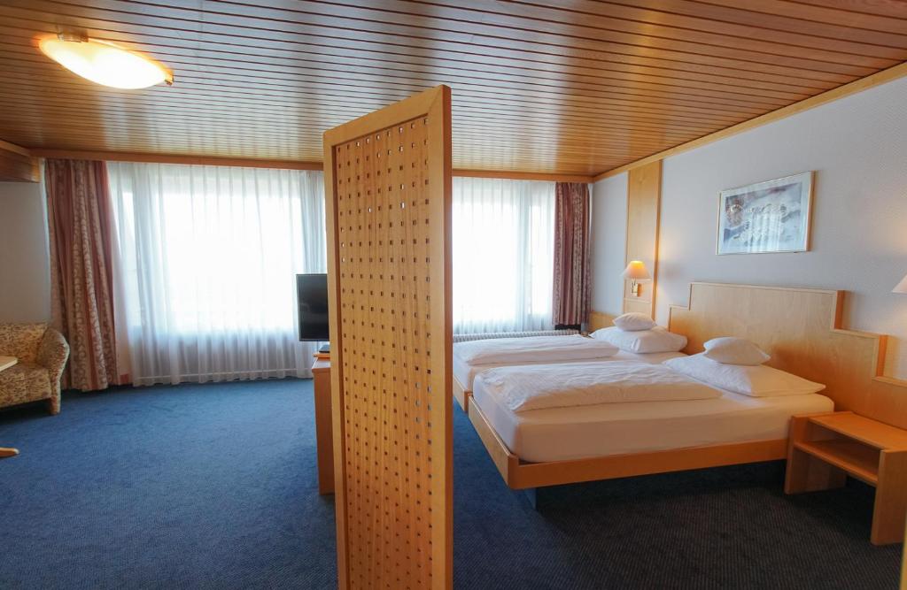 Ein Bett oder Betten in einem Zimmer der Unterkunft Hotel Stadt Breisach