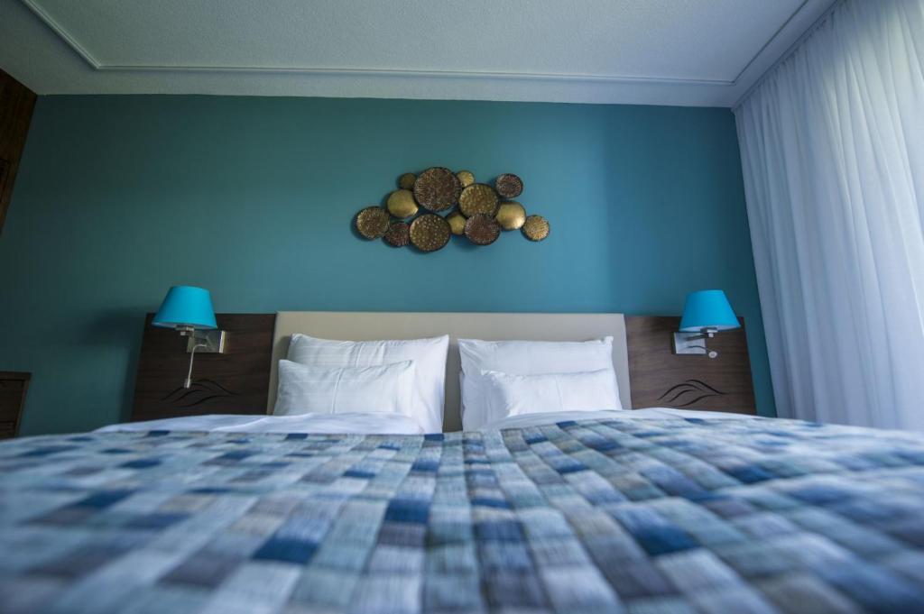 Postel nebo postele na pokoji v ubytování Boutiquehotel Wörthersee - Serviced Apartments