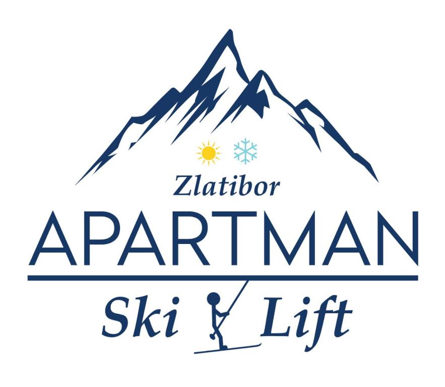 Un uomo è in piedi di fronte a una montagna di Apartment Ski Lift a Zlatibor