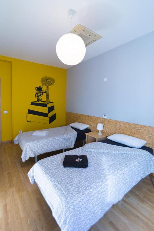 Postel nebo postele na pokoji v ubytování Onefam Sungate
