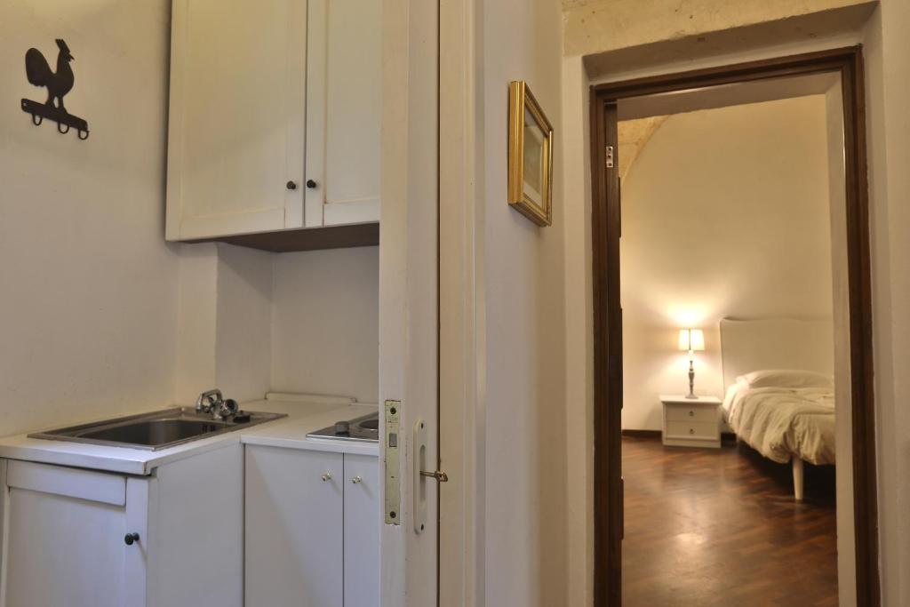 Postel nebo postele na pokoji v ubytování Chiesa Greca Suites - Lecce Selection