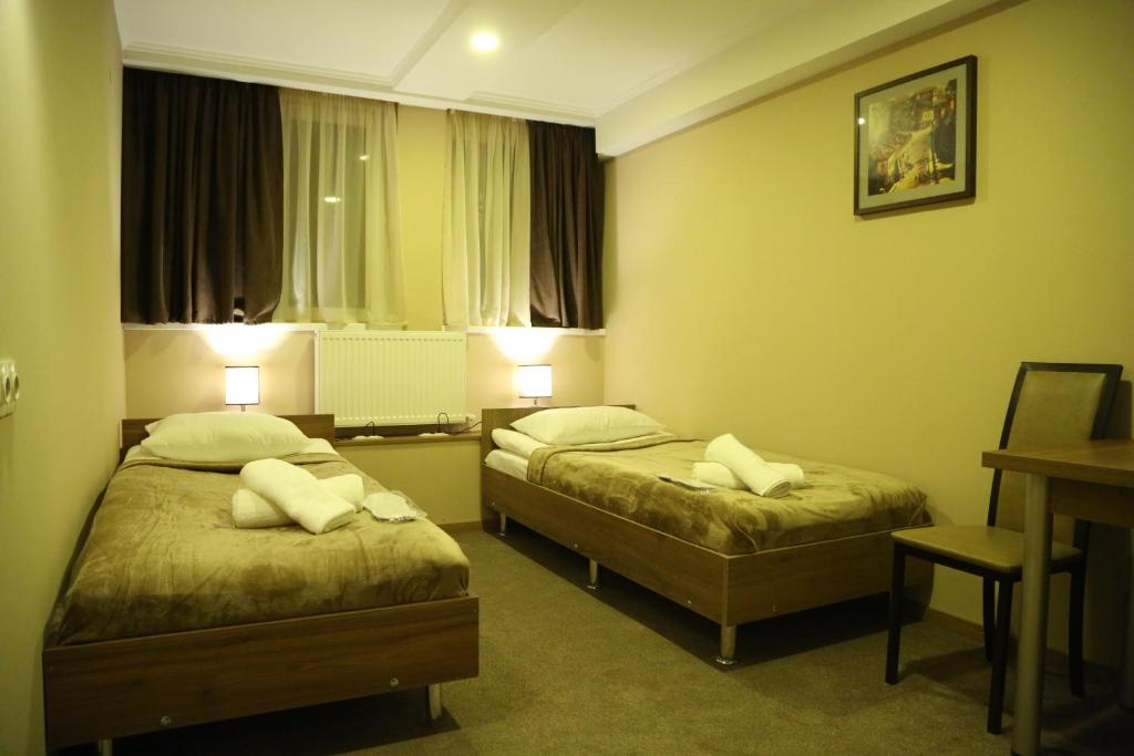 Postel nebo postele na pokoji v ubytování Hotel Reverence