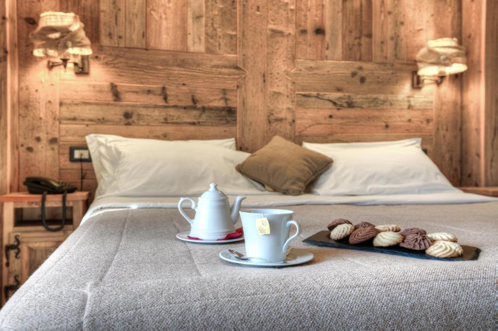 Postel nebo postele na pokoji v ubytování Hotel Meublé Mon Rêve