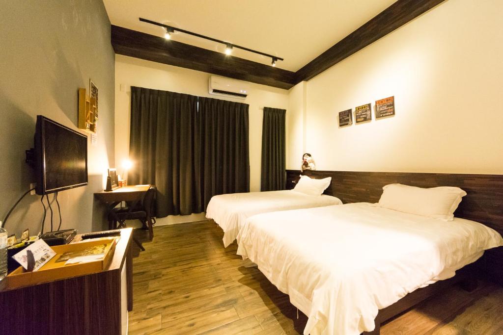 Postel nebo postele na pokoji v ubytování Ting Shuan B B&B