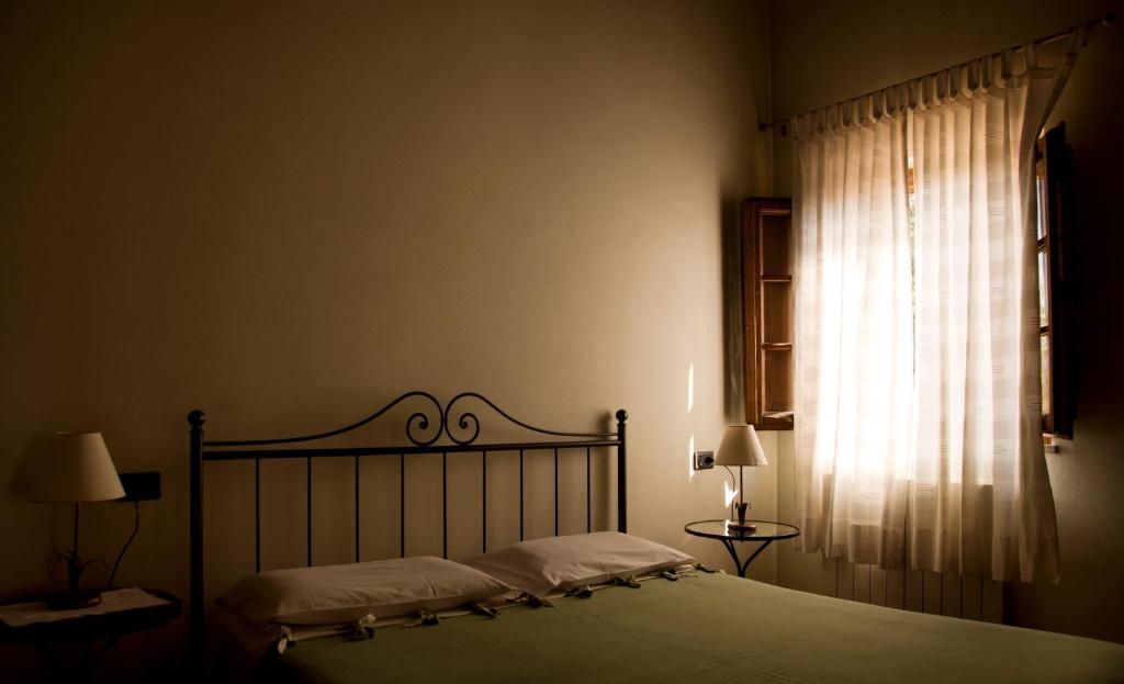 Łóżko lub łóżka w pokoju w obiekcie Agriturismo Fattoria Rozzalupi