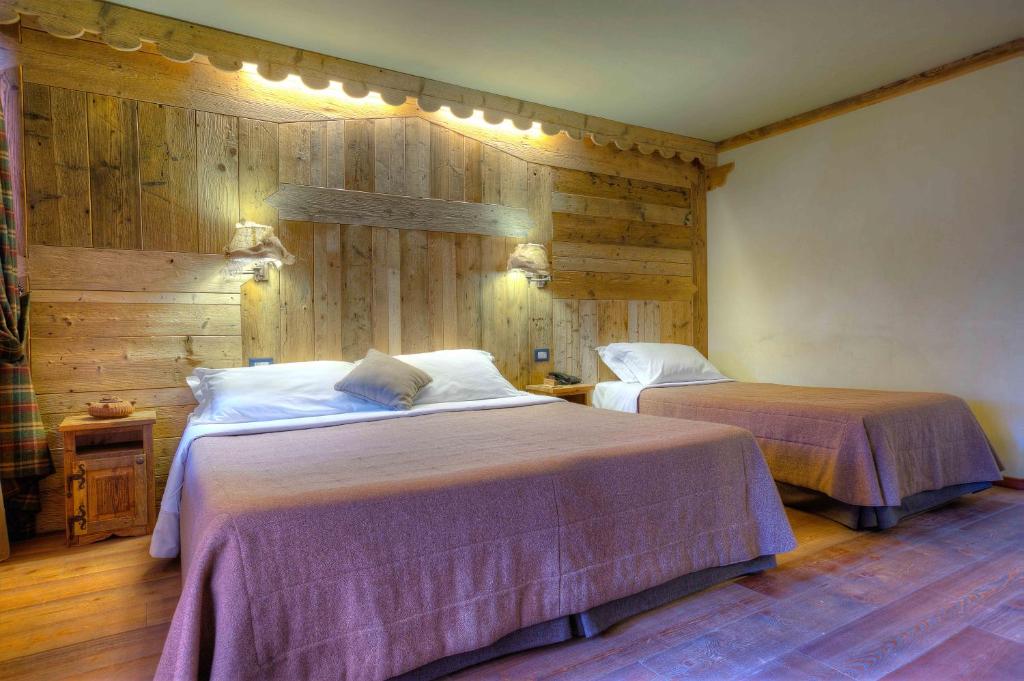 Postel nebo postele na pokoji v ubytování Hotel Meublé Mon Rêve