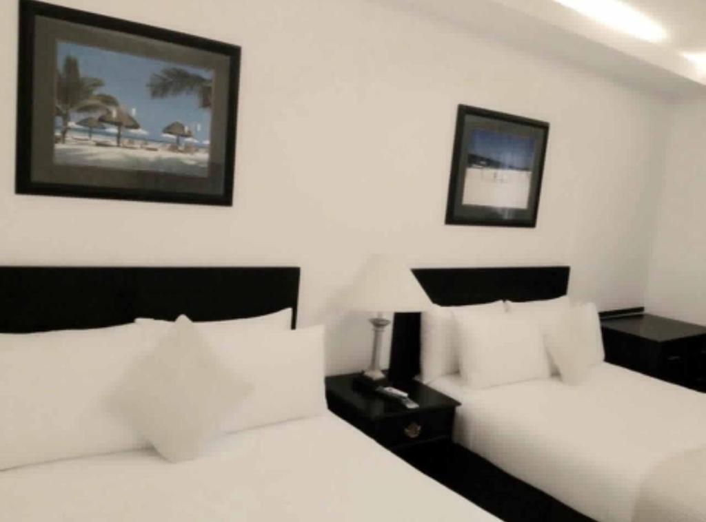 Postel nebo postele na pokoji v ubytování Chateau De Boracay