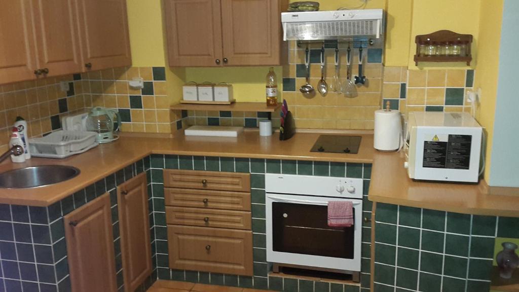 Kuchyň nebo kuchyňský kout v ubytování Apartmány Liška