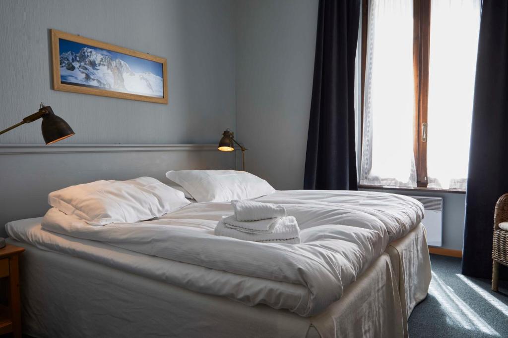 Postel nebo postele na pokoji v ubytování Hotel Monterosa