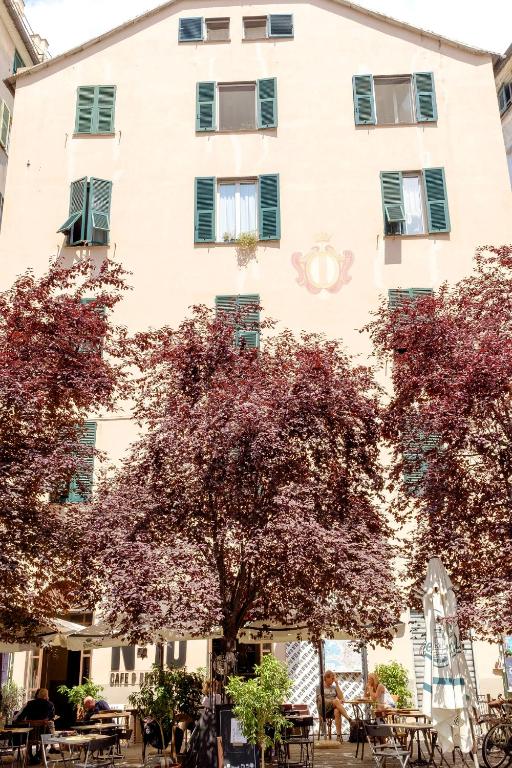 a building with trees in front of it at Ilsoleresort in Genoa