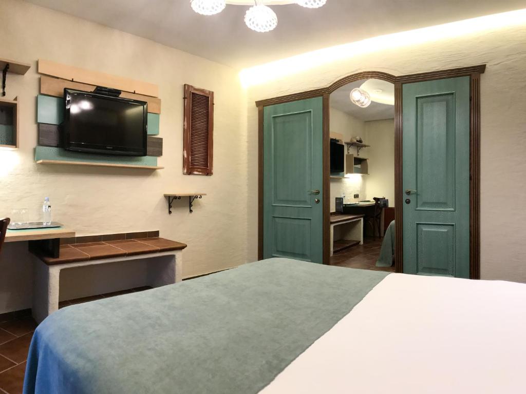 Postel nebo postele na pokoji v ubytování Komilfo Hotel