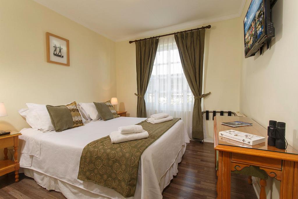 Postel nebo postele na pokoji v ubytování Hotel Carpa Manzano