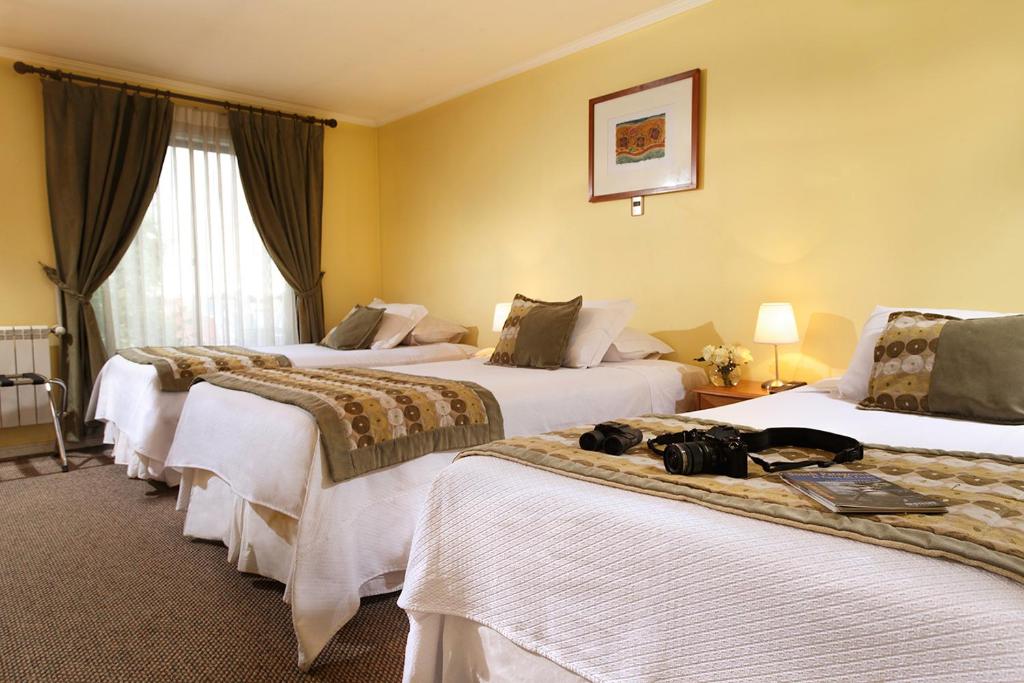 Postel nebo postele na pokoji v ubytování Hotel Carpa Manzano