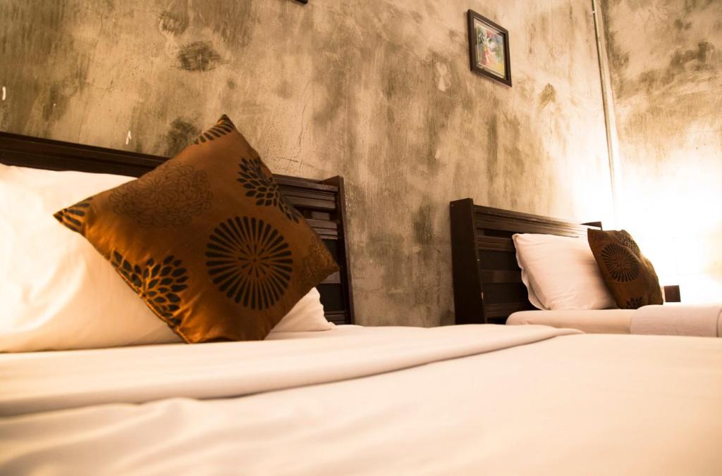 Letto o letti in una camera di Crescent Bay Resort