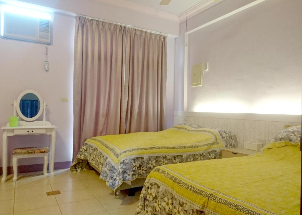 Postel nebo postele na pokoji v ubytování Mi Xiang Homestay
