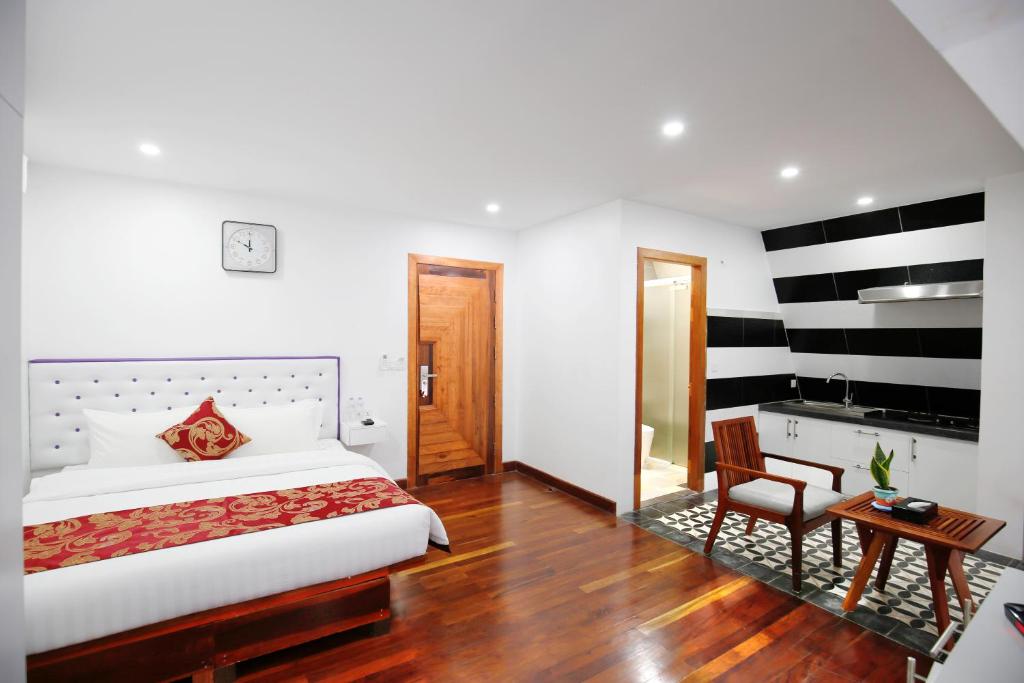 Postel nebo postele na pokoji v ubytování Zita Angkor Hotel