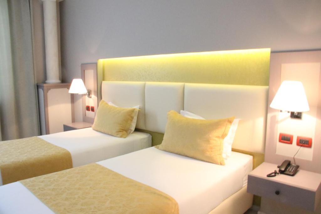 Postel nebo postele na pokoji v ubytování Te Stela Resort & SPA