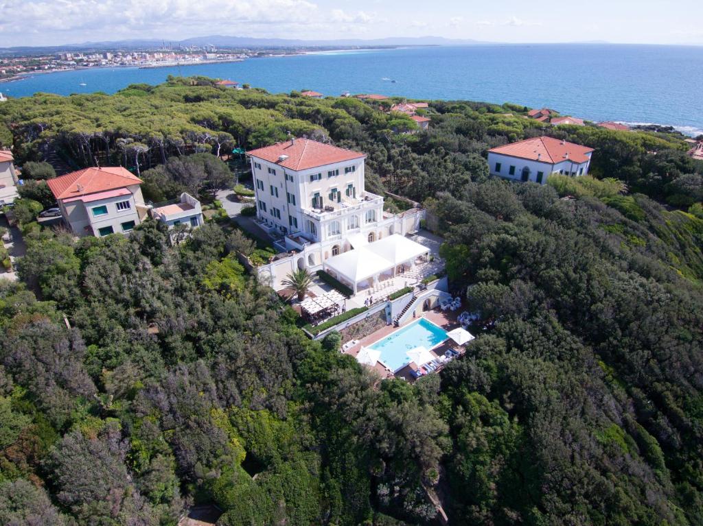 an aerial view of a large house on a hill next to the ocean at Villa Parisi Grand Hotel in Castiglioncello