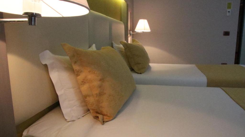 Postel nebo postele na pokoji v ubytování Te Stela Resort & SPA