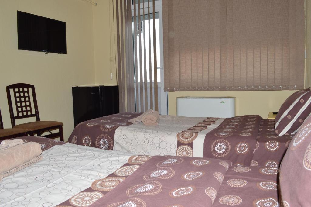 Postel nebo postele na pokoji v ubytování Dionis Hotel