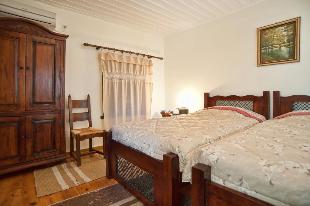 Postel nebo postele na pokoji v ubytování Alexandros Pension