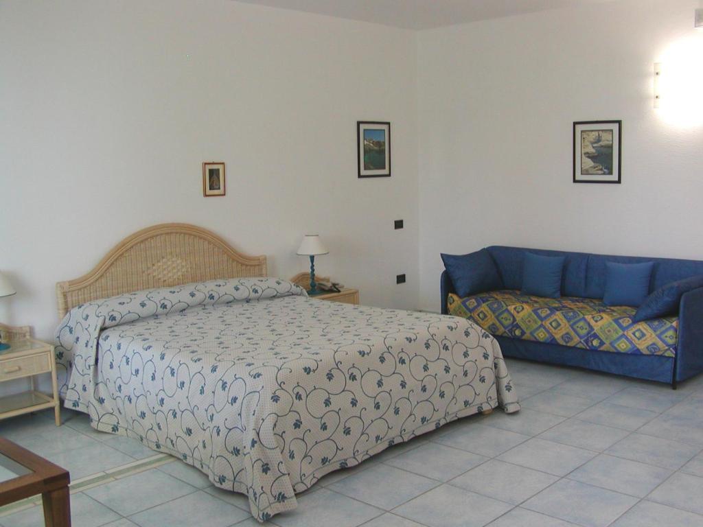 Postel nebo postele na pokoji v ubytování Hotel Selenia Residence
