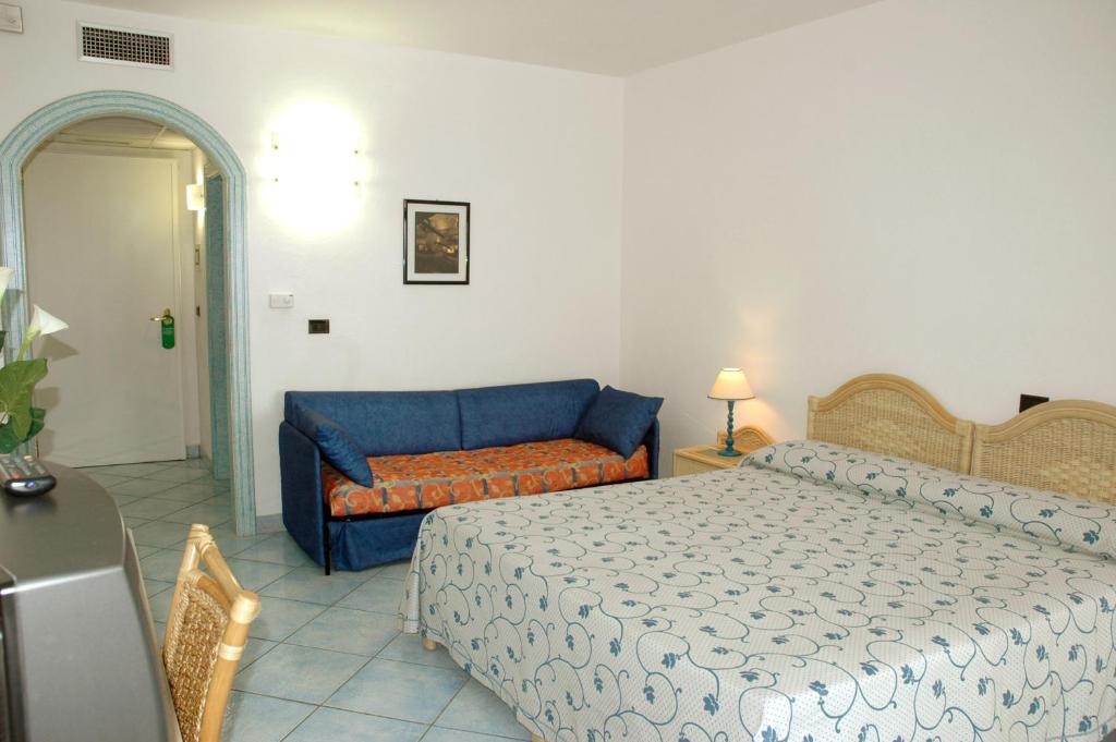 Postel nebo postele na pokoji v ubytování Hotel Selenia Residence