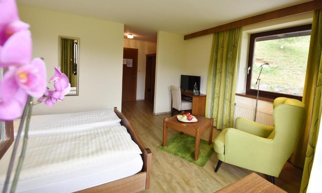 Postel nebo postele na pokoji v ubytování Hotel Restaurant Stigenwirth