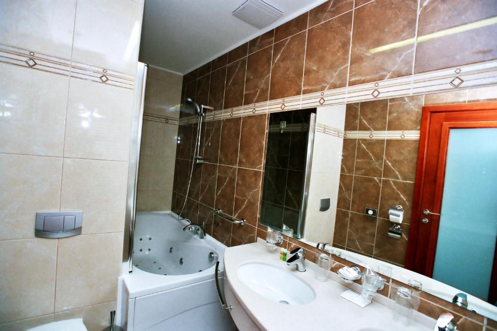 Koupelna v ubytování Hotel Savus