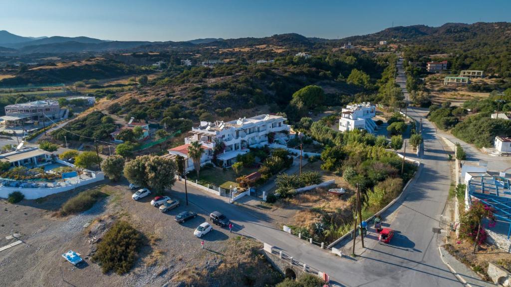 an aerial view of a town with houses and a street at Corafili Holiday Suites in Kiotari