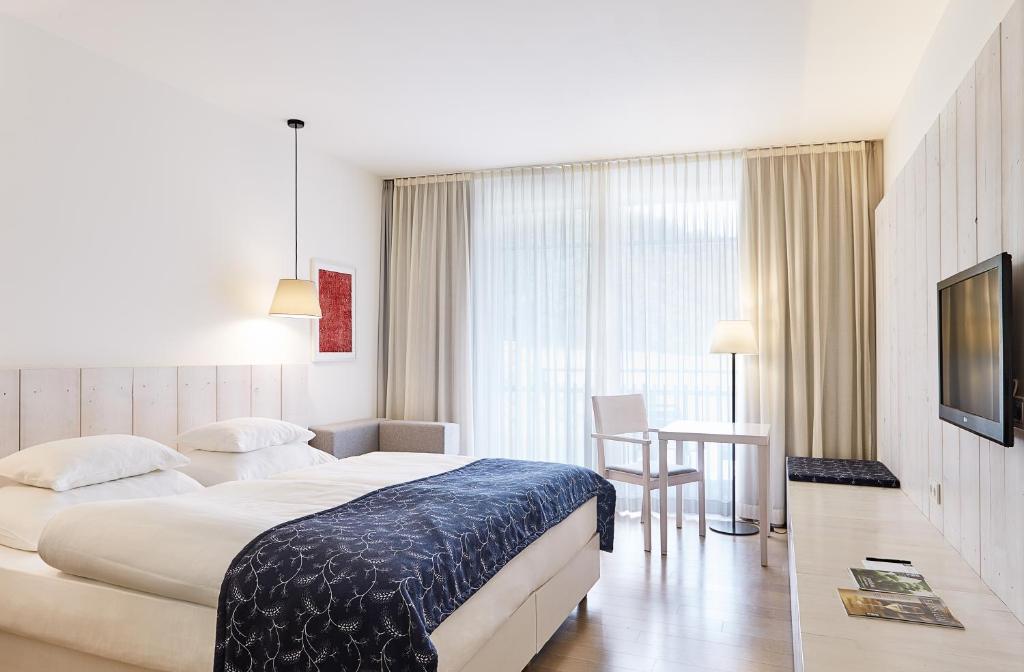 Posteľ alebo postele v izbe v ubytovaní LOISIUM Wine & Spa Hotel Südsteiermark