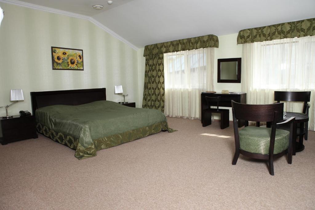 Postel nebo postele na pokoji v ubytování Lavina Hotel