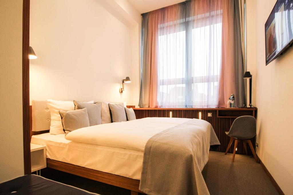 Postel nebo postele na pokoji v ubytování H24 Berlin Lichtenberg