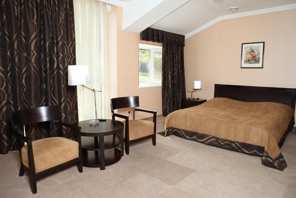 Postel nebo postele na pokoji v ubytování Lavina Hotel