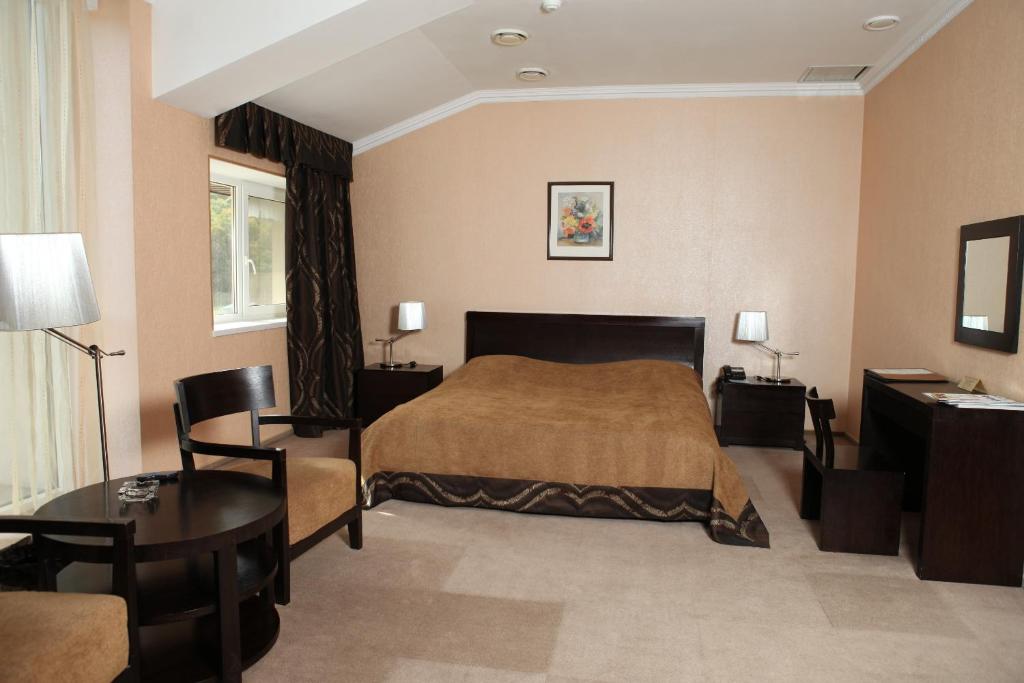 Postel nebo postele na pokoji v ubytování Lavina Hotel