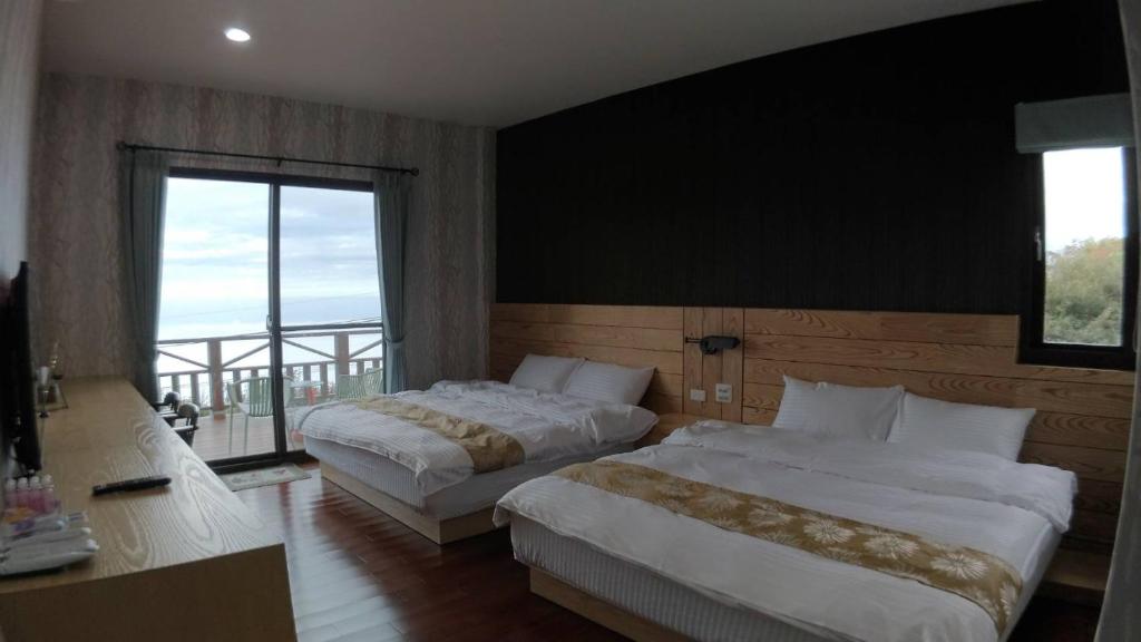 Postel nebo postele na pokoji v ubytování Shi Home 1639