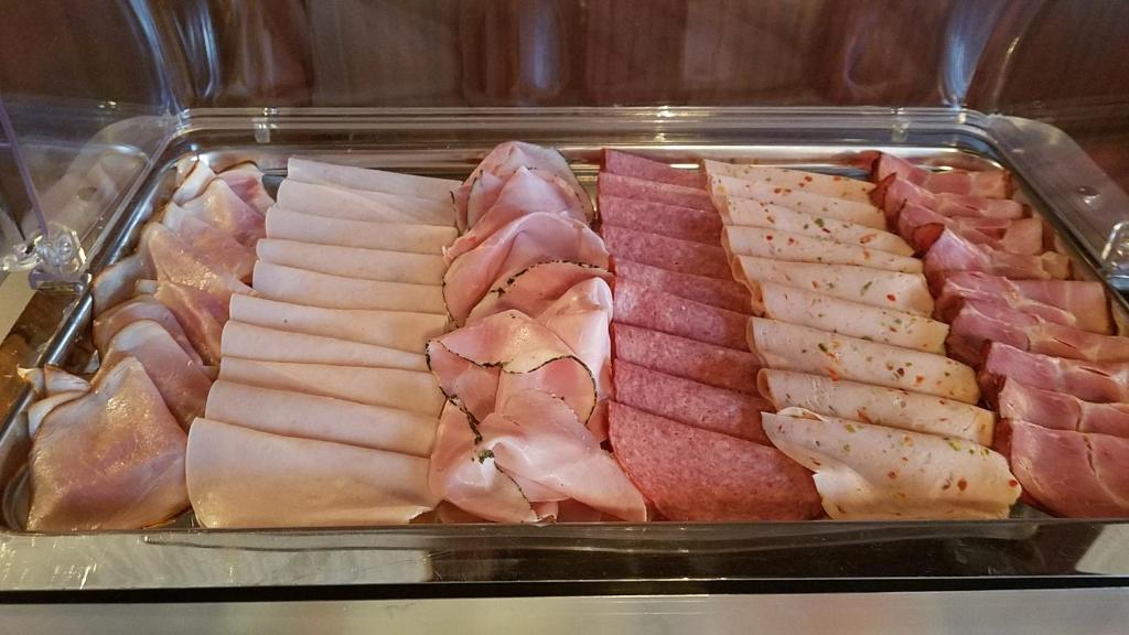 a tray of different types of meats and bacon at Retzerlandhof Familie Graf in Zellerndorf