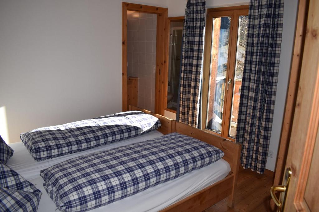 Postel nebo postele na pokoji v ubytování Residence Miragolf