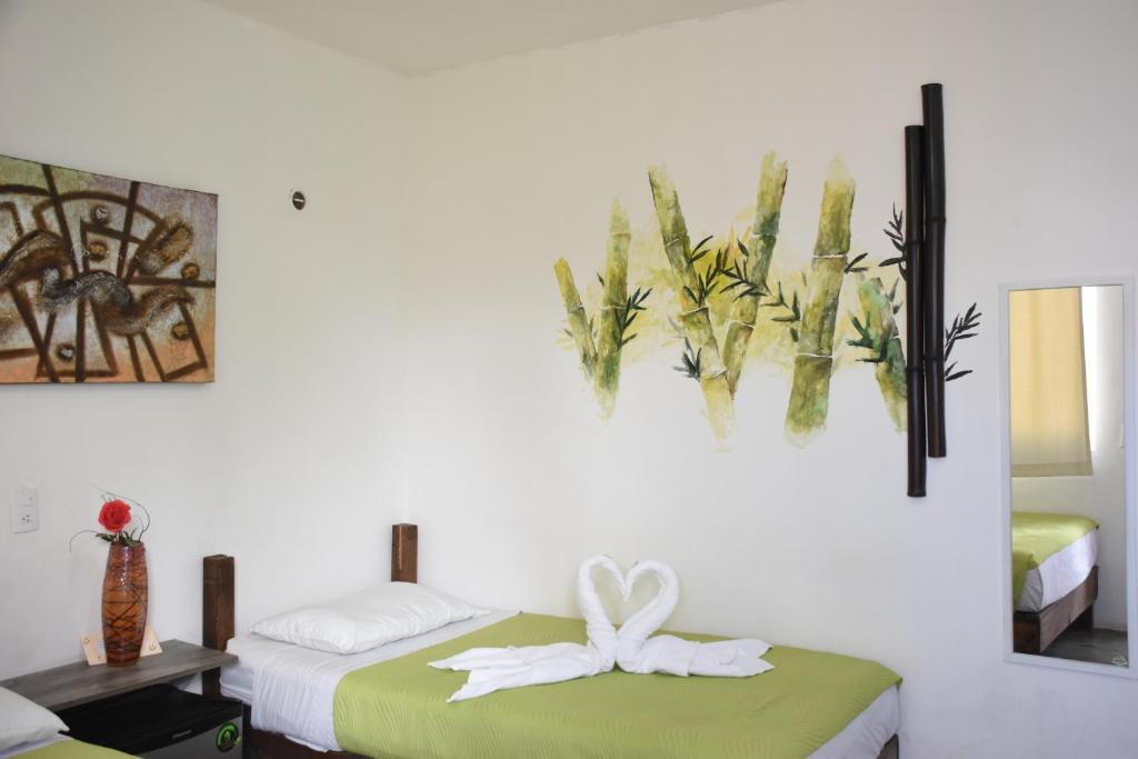 Postel nebo postele na pokoji v ubytování Emotion Avenida Tulum Hotel & Hostal