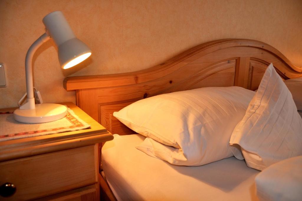 Postel nebo postele na pokoji v ubytování Hotel Schick