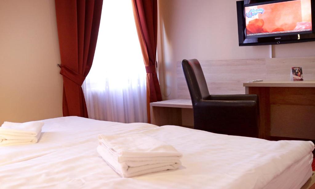 Posteľ alebo postele v izbe v ubytovaní Hotel Stardust