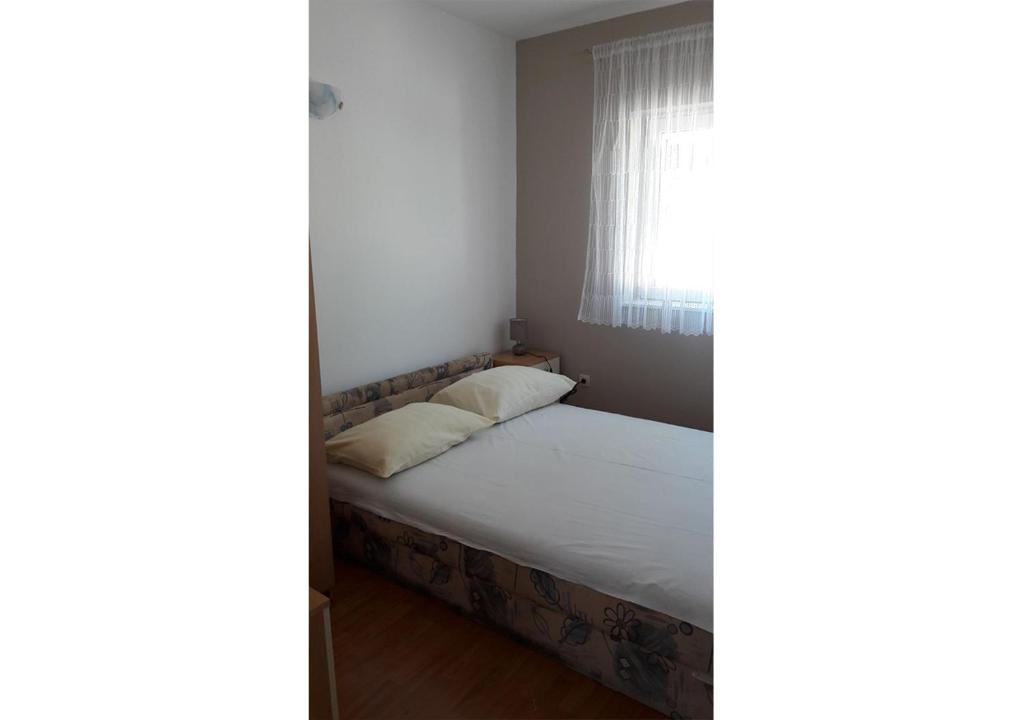 Postel nebo postele na pokoji v ubytování Apartments Stef