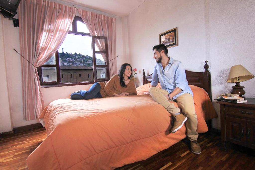 Postel nebo postele na pokoji v ubytování Hotel Huasi Continental