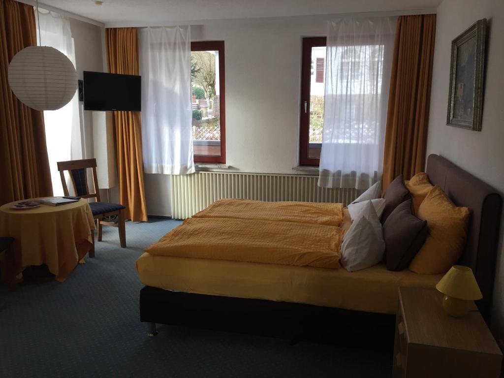 Postel nebo postele na pokoji v ubytování Hotel Carlsruh