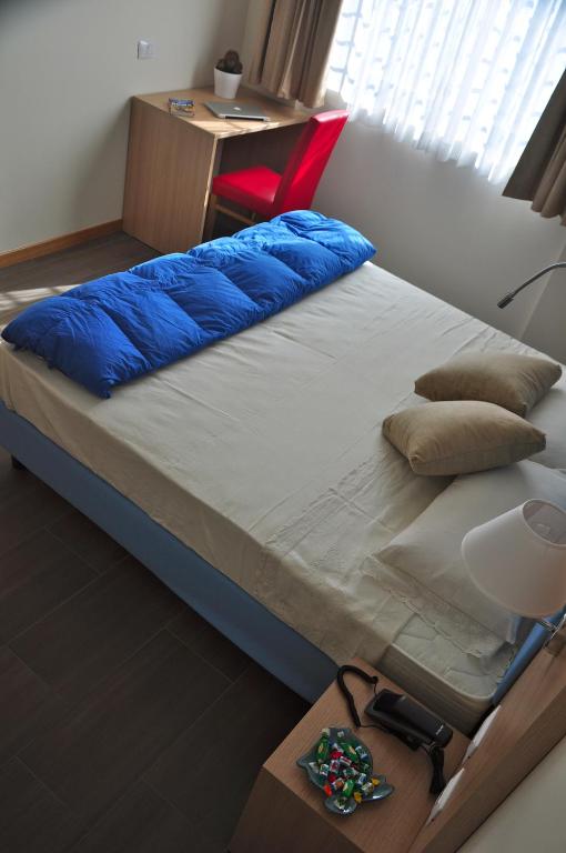 Postel nebo postele na pokoji v ubytování Hotel 325 Tor Vergata