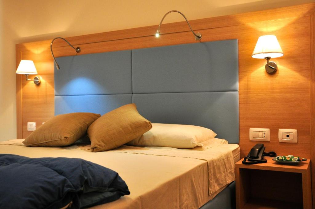 Postel nebo postele na pokoji v ubytování Hotel 325 Tor Vergata