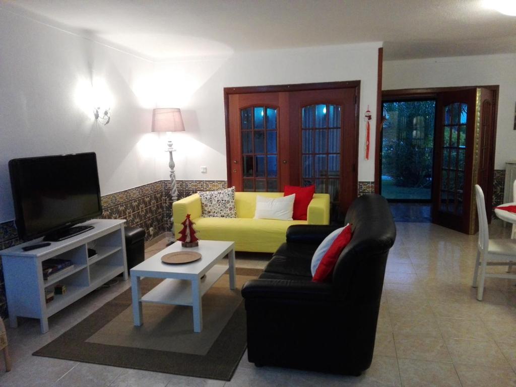 Uma área de estar em Villa Benedito